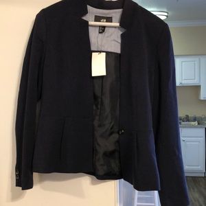 Navy blue blazer. Never worn. Perfectly in tact.
